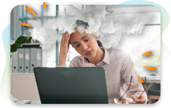 A frustrated woman with her eyes closed sits at a desk with a laptop, holding her hand to her forehead, with a cloud floating above her head to represent brain fog in relations to food intolerances.