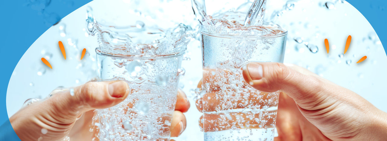 Two glasses of water clinking together