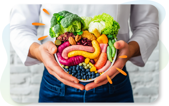 person holding array of healthy foods resembling a gut