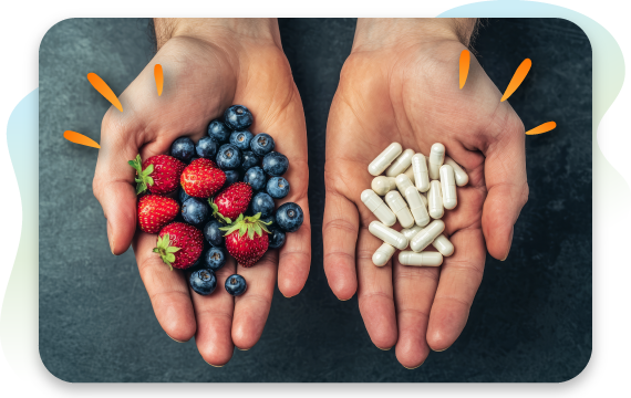 Hands holding fresh berries in one palm and supplement capsules in the other.